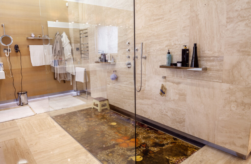 walkin shower with chrome fixtures marine decor floor bathroom 1