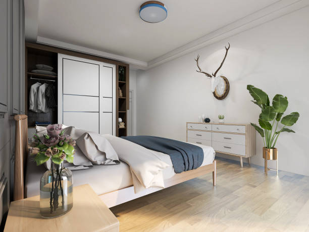 Modern design bedroom with large bed, chest of drawers, greenery